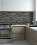 Modern kitchen with brick stone backsplash and sleek wooden cabinets