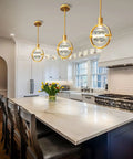 Dope Modern Crystal Pendant Light In Gold Brushed Brass Finish With 4.33 Inch K9 Crystal above kitchen island