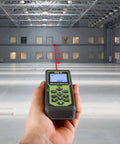 Pro Grade Laser Distance Meter 325 Ft in hand, displaying reading, ideal for indoor measurements and home renovation projects.