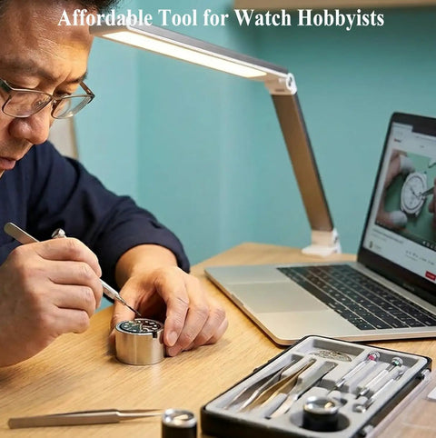 Person using Watch Movement Holder For NH35 NH36 7S26 7S36 4R Pro Grade Movement Base Repair Tool with tools and laptop nearby