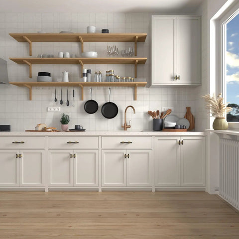 Modern kitchen with matte black and gold T bar cabinet knobs on white cabinets and open wooden shelves