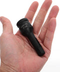 Hex impact socket adapter with extended sleeve, black metal, held in hand