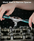 Hands using 76-Piece SAE and Metric Tap and Die Set With Extendable Ratcheting Handle on metal engine parts.
