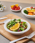 175 Pack 16 Oz Sugarcane Bagasse Soup Bowls Microwave Safe Heavy Duty Disposable For Hot Soups Desserts And Snacks Eco Friendly Compostable Dinnerware filled with fresh salad