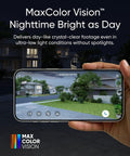 Hand holding phone displaying Top Tier Solar Outdoor Security Camera With 4K MaxColor Night Vision footage, house view at night.