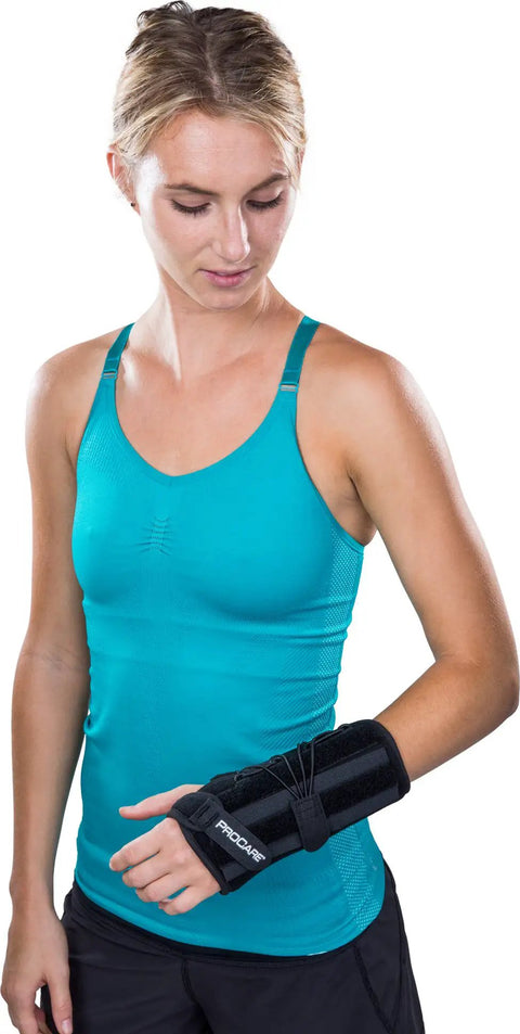 Person wearing Quick Fit II Left Wrist Support Brace One Size Fits Most Easy Fit Immobilizer With Single Pull Lacing And Dorsal Stay Pod.