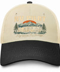 Funny RV Pilot Camper Road Trip Hat Avid Traveler Baseball Cap with mountain and RV illustration, beige and black design.