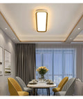 Slick Modern Wall Sconces With Smooth Remote Dimming For Real Cozy Living Rooms And Bedrooms Solid Rust Proof Metal Crafted With Crisp Acrylic Panels Delivering A Chill Glare Free Glow Everywhere Indoors in dining area with warm light.