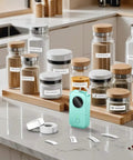 Top Tier Bluetooth Label Maker Prints Crisp Adhesive Text Instantly amidst labeled jars on a kitchen countertop.