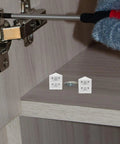 White Plastic Corner Brackets 20-Pack, 90-Degree Shelf Supports With Four-Hole Design being installed on a wooden cabinet corner