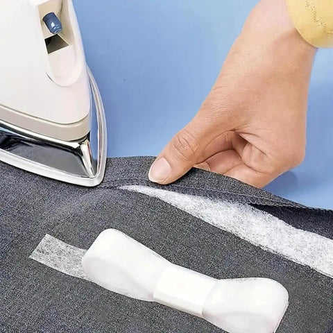 One Roll No Sew Hemming Tape With Heat Fusible Bonding being applied with an iron on fabric for quick clothing hemming repair