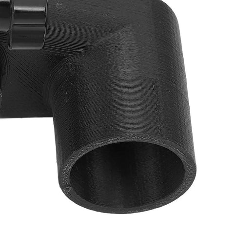 Close-up of a black 52mm tube connector for Slick CNC Router Dust Shoe With 52MM Magnetic Mount For No Sweat Dust Collection And Sawdust Capture On Woodworking Routers And Engraving Machines Keeps Shop Clean.