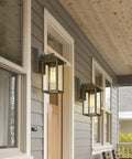 2 Pack Outdoor Wall Sconces Lantern Lights With Seeded Glass In Black Finish, Weatherproof Aluminum Exterior Fixtures, mounted on porch wall