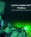 Angler using Green Underwater Fishing Light For Night Angling on kayak at night, showing green glow attracting fish.