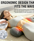 Woman relaxing with Totally Crushing Lower Back Pain With This Electric Lumbar Support Pillow that fits the waist, featuring gray memory foam.