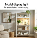 Open Circle LED Table Lamp With Dimmable Touch Control And Warm 3000K Light In Black on shelf in stylish living room