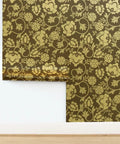 Premium Brown Gold Metallic Wallpaper With Block Print And Textured Finish For Modern Home Decor on wall with floral design.