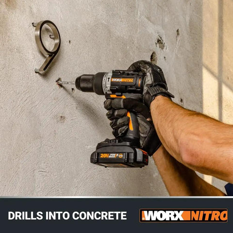 Person using Power Share 20V Cordless Hammer Drill With Brushless Motor 1/2 In Heavy-Duty Chuck Nitro Performance on concrete