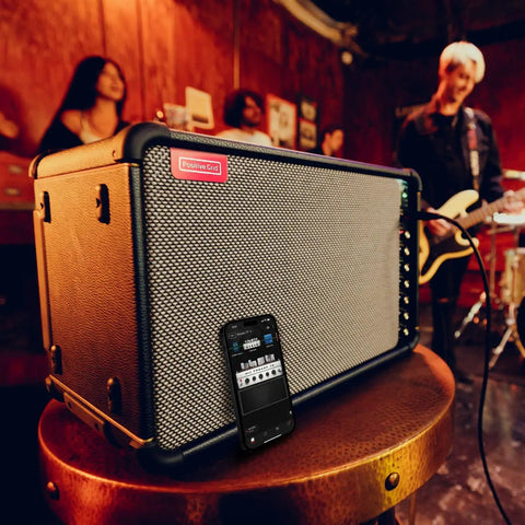 Spark Live Smart Guitar Amp With 4-Channel PA, Built-In Mixing, Effects, And App Control, in live music setting.