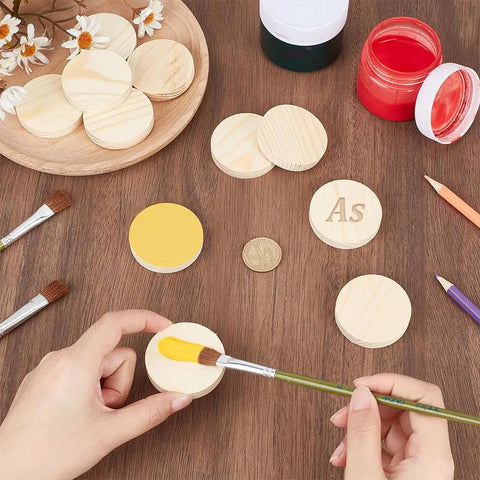 Unfinished Wooden Circles Craft Blanks, Smooth Two Inch Plywood Discs For Diy Painting And Woodburning with paintbrush.