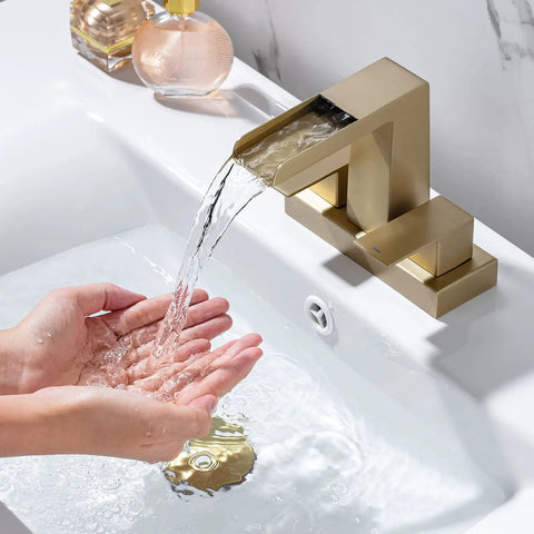 4 Inch Centerset Bathroom Waterfall Faucet With Two Handles For 3-Hole Lavatory Vanity, Brushed Gold Finish, flowing water into hands
