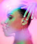Woman wearing Customizable Gemstone Earplugs With 21 dB Noise Reduction For Clear Hearing At Concerts, Raves, and Events