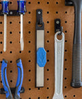 Carbide Cutter Honing System with diamond sharpening tool and magnetic grip for carbide inserts hanging on pegboard