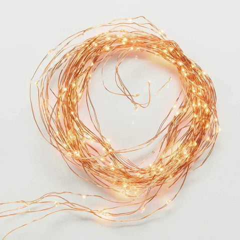 Plug In Fairy Lights With 6.56 Ft Copper Wire, 14 Branch Strands And 280 LEDs, Warm White Twinkle String Lights arranged in a coil.