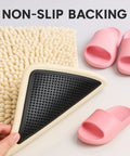 Heavy Duty Rug Gripper Pads With Adhesive Strips For Non Slip Carpet Corners Kit shown beneath a textured rug with pink slippers.