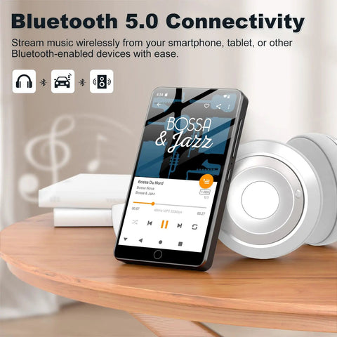 144GB Android 13 MP3 Player With Bluetooth And WiFi, 4 Inch Touchscreen showing music app on wooden table with headphones