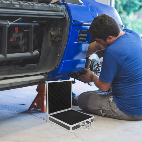 Boss Grade Aluminum Alloy Toolbox Featuring Secure Locking Panel And Portable Tool Stash Hella Tough For Hardworking Crews And DIY Enthusiasts at a car repair.