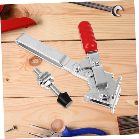 Two Piece Welding Toggle Clamps With Rubber Tips on wooden surface with hex bolt visible