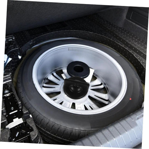 Spare Tire Bolt Retainer Clamp for Vehicle Wheels installed in trunk, holding down a spare tire, visible easy install hardware.