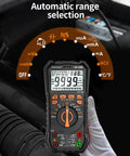 Digital Multimeter With Auto Range, 9999 Counts in use for car engine diagnostics in garage setting. "Automatic range selection" text visible.