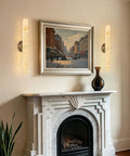 Natural Alabaster Brass Wall Sconce, Modern Bronze Marble Sconce illuminating a living room next to a fireplace.