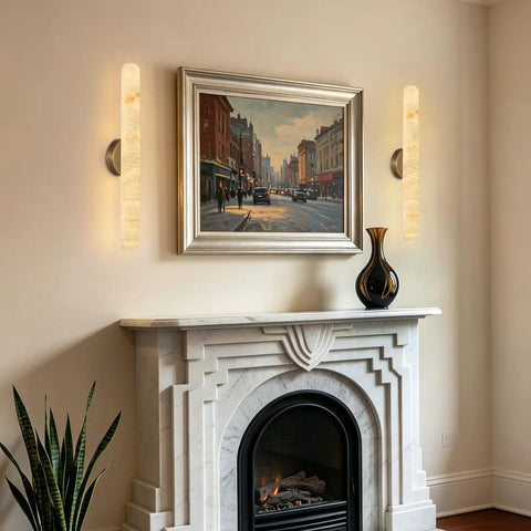Natural Alabaster Brass Wall Sconce, Modern Bronze Marble Sconce illuminating a living room next to a fireplace.