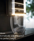 Hassle Free Fully Automatic Coffee And Espresso Maker With Built In Milk Frother, Quiet Grinder, One Touch Brewing, Programmable Daily Timer, Top Shelf Kitchen Essential showing CupSensor adjusting spout height.