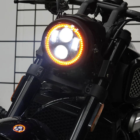 5.75 Inch Black Motorcycle Headlight With Smoked Amber Halo DRL And Matte Black Housing Includes 32 To 40 Mm Fork Tube Side Mount Brackets Fits Most Motorcycles From Cruisers And Cafe Racers To Choppers