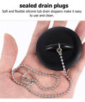2 Pcs Black Silicone Bathtub Drain Stopper with Chain for Shower Use held in hand, showcasing flexible design and attached chain.