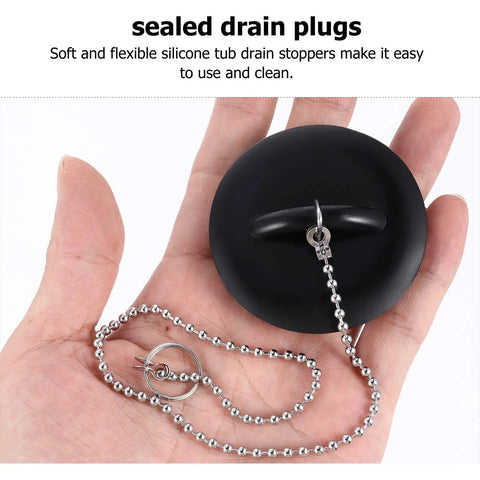 2 Pcs Black Silicone Bathtub Drain Stopper with Chain for Shower Use held in hand, showcasing flexible design and attached chain.