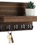 Wall Mounted Key And Mail Organizer With Shelf And Large Hooks For Keys Bags Coats And Leashes Keeps Your Essentials In One Spot Paulownia Wood Key Hanger With Mounting Hardware Brown Finish Durable Entryway Organizer displayed with keys and plant.