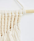 Premium Unfinished Hardwood Dowel Rods 1/4 X 12 Inches Ten Pack Smooth Finish used in a macrame wall hanging.
