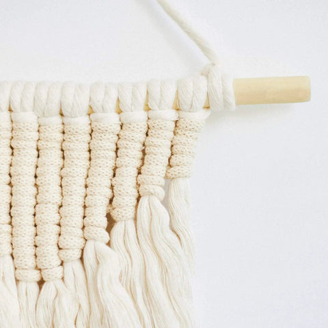 Premium Unfinished Hardwood Dowel Rods 1/4 X 12 Inches Ten Pack Smooth Finish used in a macrame wall hanging.