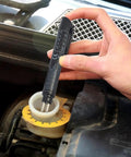 Hand using Pen Style Brake Fluid Tester With Five LED Indicators For Quick DOT 3 DOT 4 DOT 5.1 Fluid Check on car reservoir