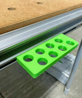 Premium Bench Dog Storage Rack For Festool Mft Three Table Side Mount Holder showing green plastic organizer with holes for dog pins.