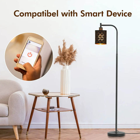 Gothic Style Floor Lamp With Laser Cutout Lampshade LED Arc Standing Light beside modern table with phone control in living room