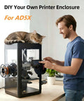 Man next to 3D printer with cat on top, featuring DIY Upgraded Enclosure Kit for Falshforge AD5X with acrylic panels and screws.