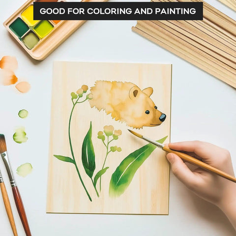 Unfinished Balsa Wood Sheets And Dowel Rods Craft Kit with a hand painting leaves and animal on a basswood sheet, paint and brushes visible