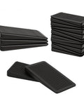 Adjustable Furniture Levelers With Flexible Plastic Wedge Shims That Straight Up Stabilize Wobbly Tables Chairs Bed Frames And Pipes In A Rock Solid Wobble Free 20 Pack Bundle, featuring stacked black PVC shims.
