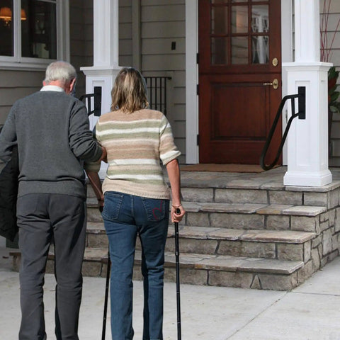 Two people holding a Matte Black Wall Mounted Handrail For 1 To 3 Steps Garage Porch Garden Grab Bar Heavy Duty Safety Rail